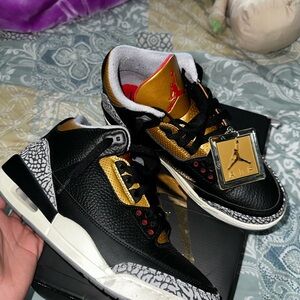 Jordan Black and Gold Sneakers